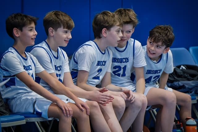Broncos sharing a laugh on the bench