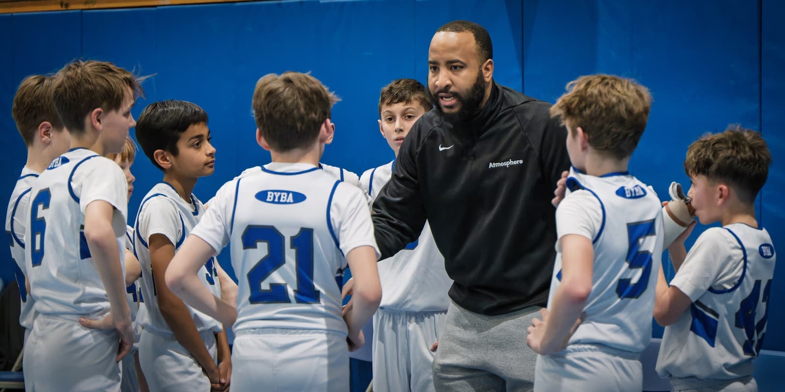 A BYBA coach firing up the huddle