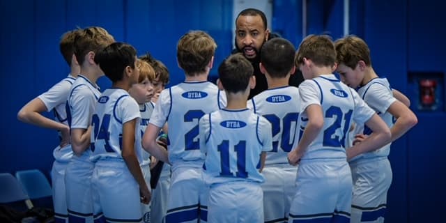 A BYBA coach talking to his team before the game