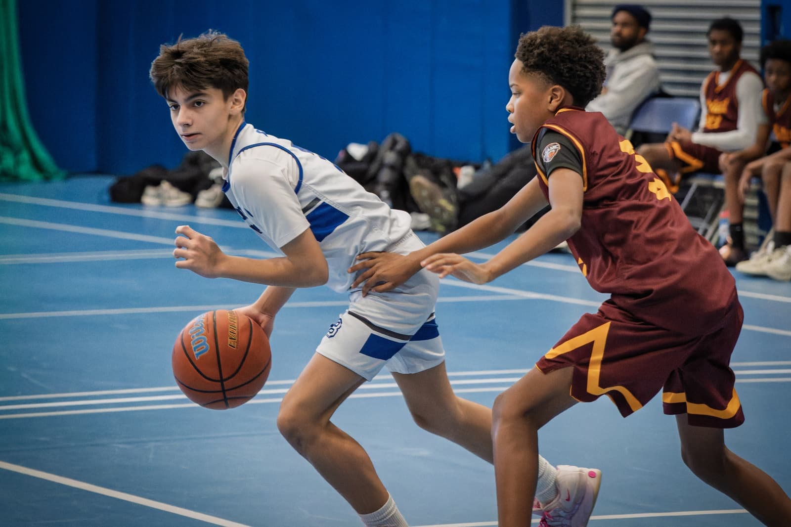 A Bronxville player dribbling past a defender