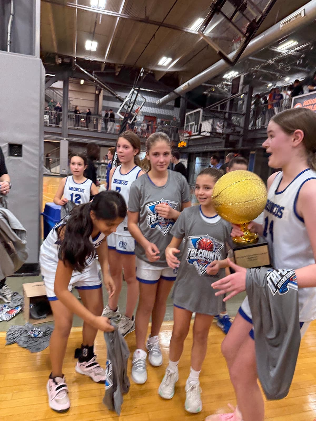 BYBA girls celebrating their championship win