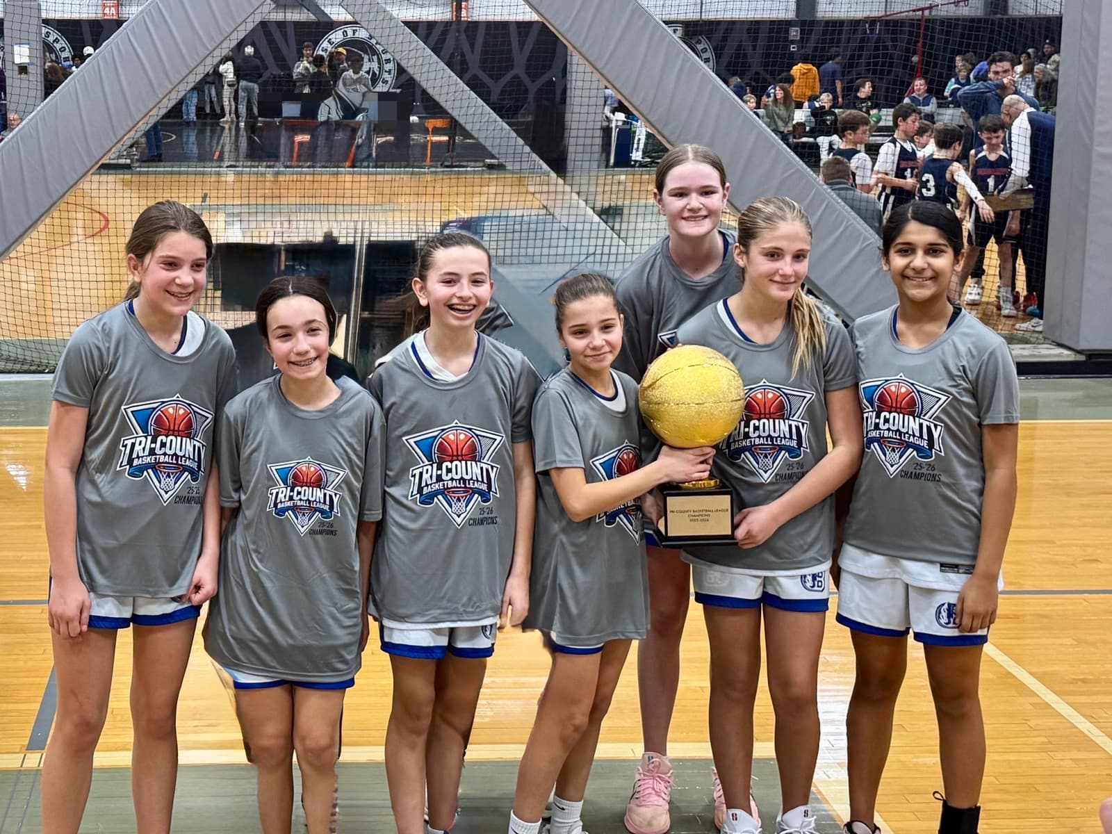The BYBA girls team posing with the championship trophy