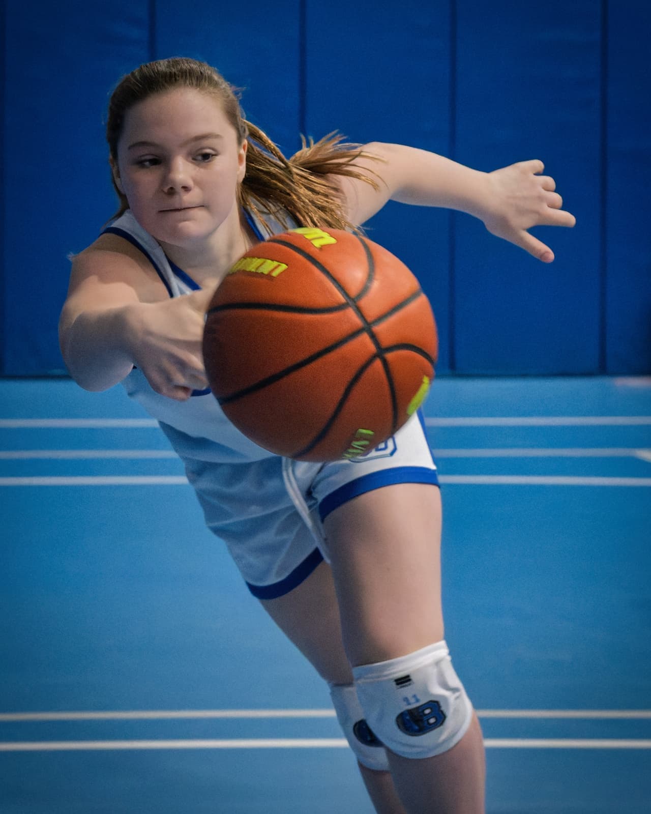 A BYBA girl diving to save the ball