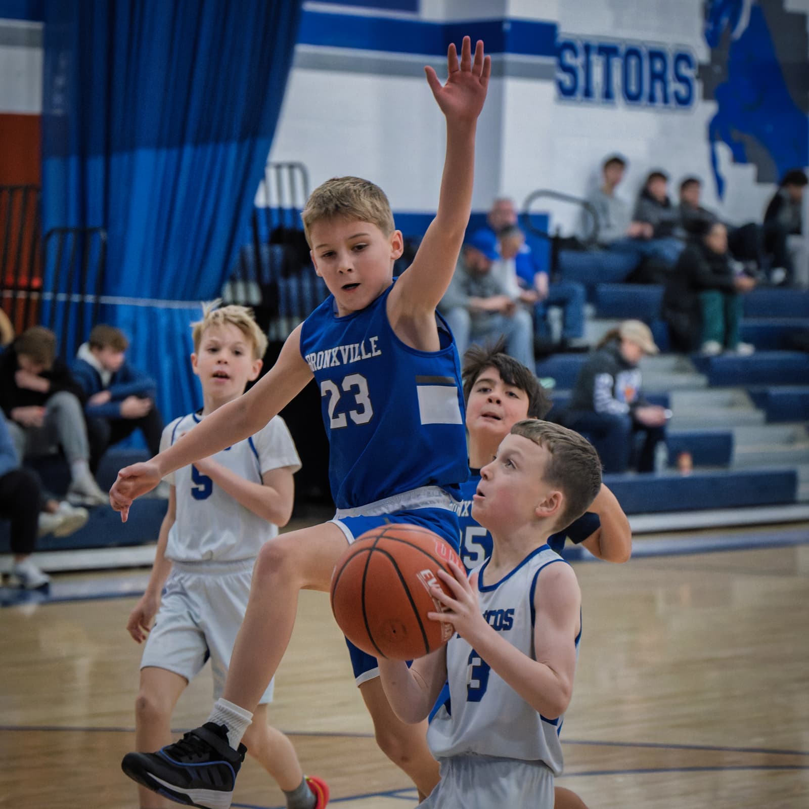 A Bronxville defender challenging a shot in a rookie game