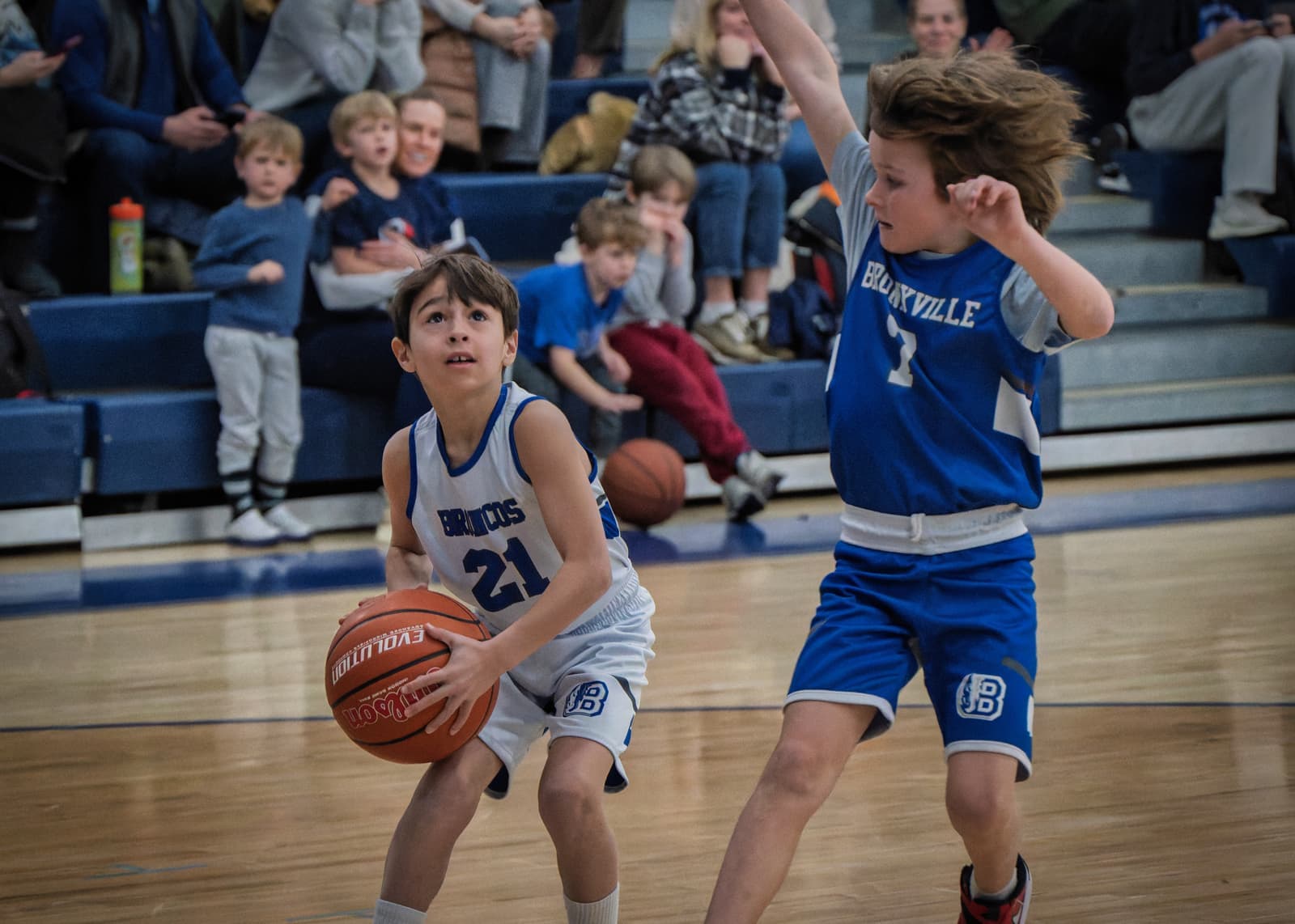 A young player squaring up to shoot against a Bronxville defender