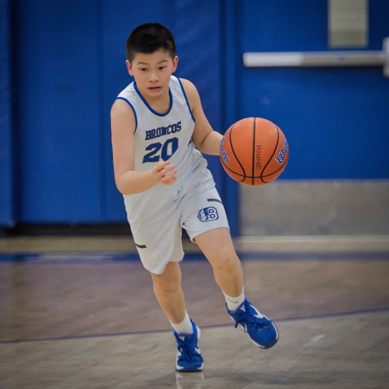 A Bronco bringing the ball up the court