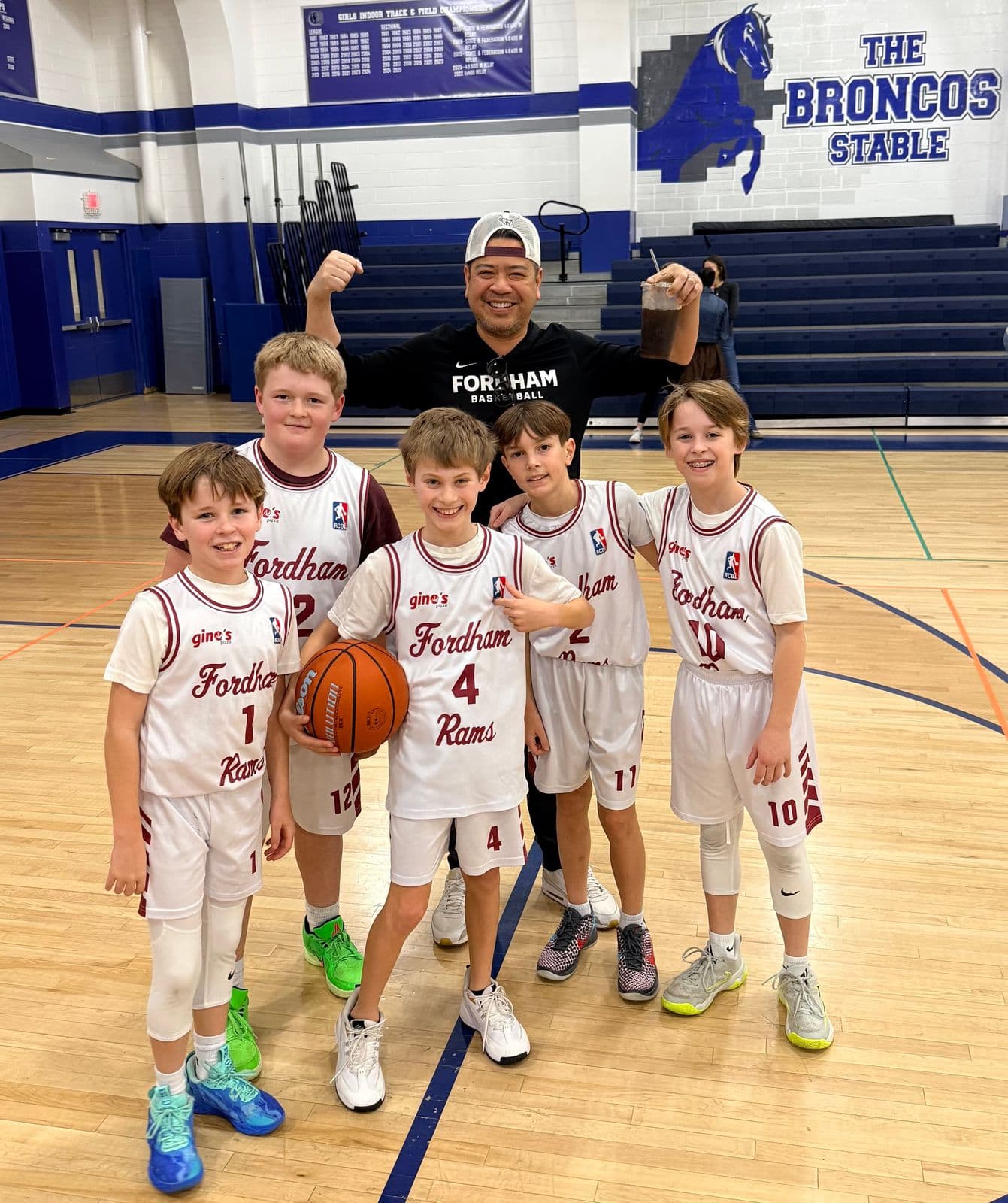 BYBA players celebrating in the Broncos Stable gym