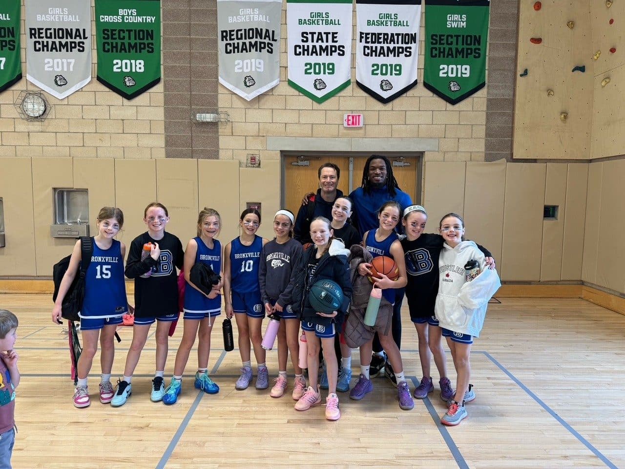 A BYBA girls team with their coaches after a game