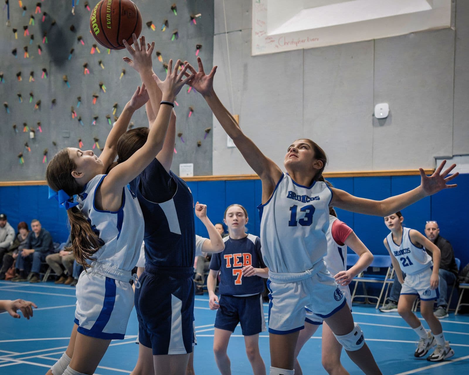 BYBA girls fighting for a rebound in a travel game